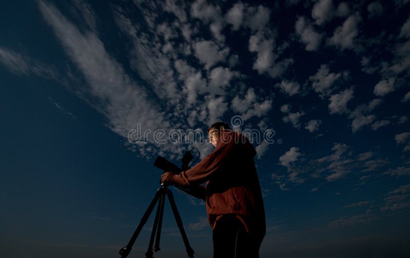 Man Shooting the Night Starry Sky with a Tripod Stock Photo Image of