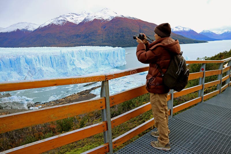 Man Shooting Photos of Perito Moreno Glacier from the Boardwalk in the Los Glaciares National Park, El Calafate, Argentina