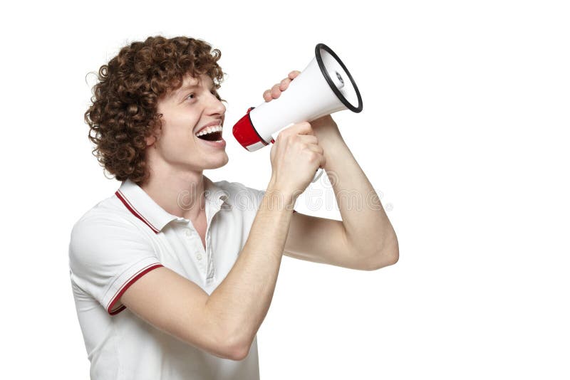 Happy man making announcement over a megaphone against white background. Happy man making announcement over a megaphone against white background