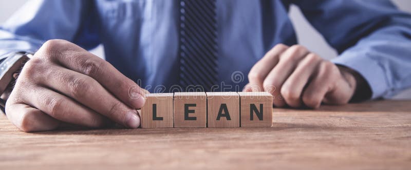 Man showing LEAN word on the cubes stock image Man showing LEAN word on the cubes stock image