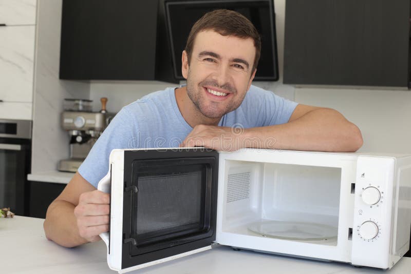 Man Showing a Microwave Oven Stock Image Image of domestic, dinner