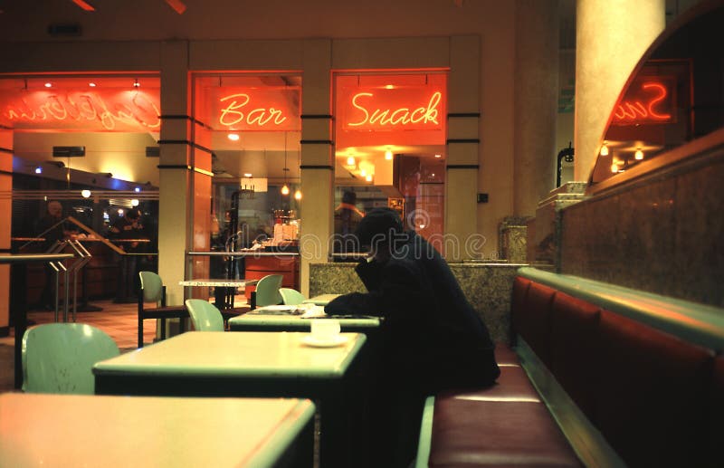 Man sits in cafe stock image. Image of seat, rests, neon - 1770865