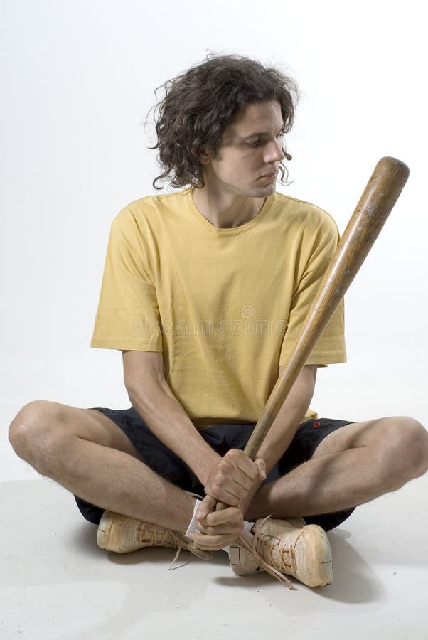 Man Sitting with a baseball bat - Vertical