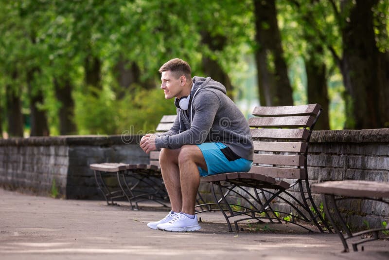 Old Man Sitting On Park Bench