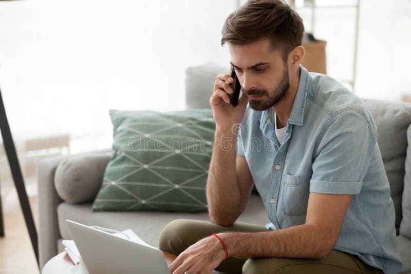 Male working at home has serious conversation with client royalty free stock photos Male working at home has serious conversation with client royalty free stock photos
