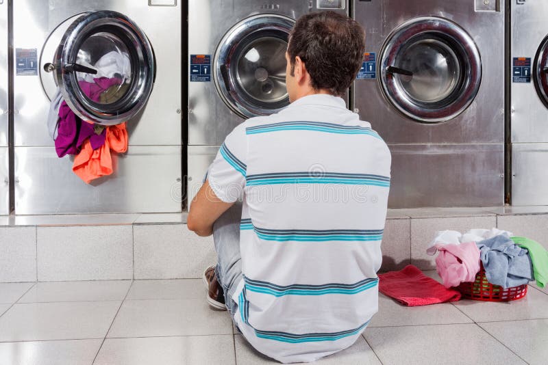 Young Man Putting Clothes in Washing Machine Stock Image Image of