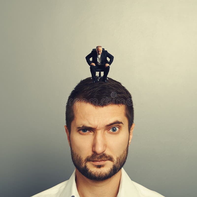 Man Sitting on the Office Chair and Looking at Big Man Stock Photo Image of business