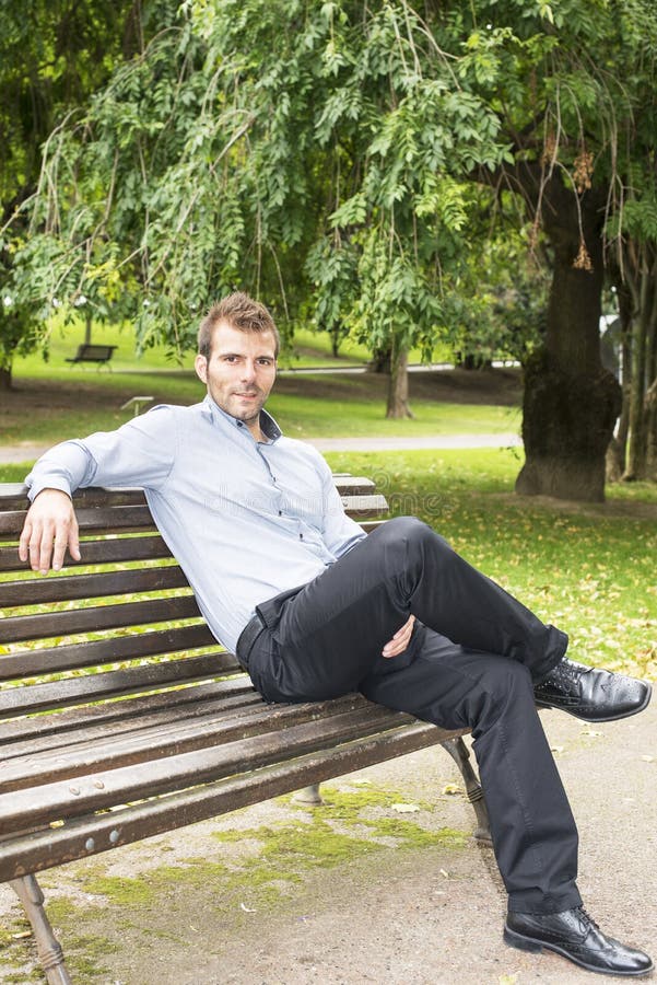 Man sitting and relaxing on a bench.