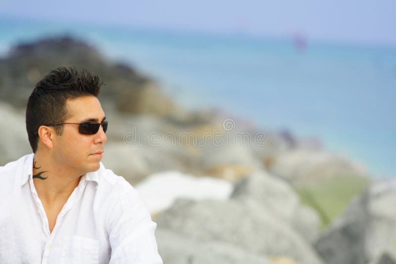 Man Sitting on the Rocks