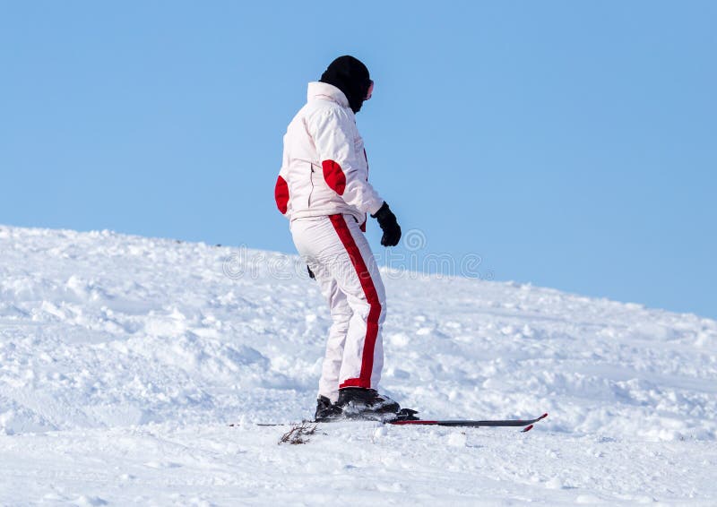 Man skiing in the snow in winter.