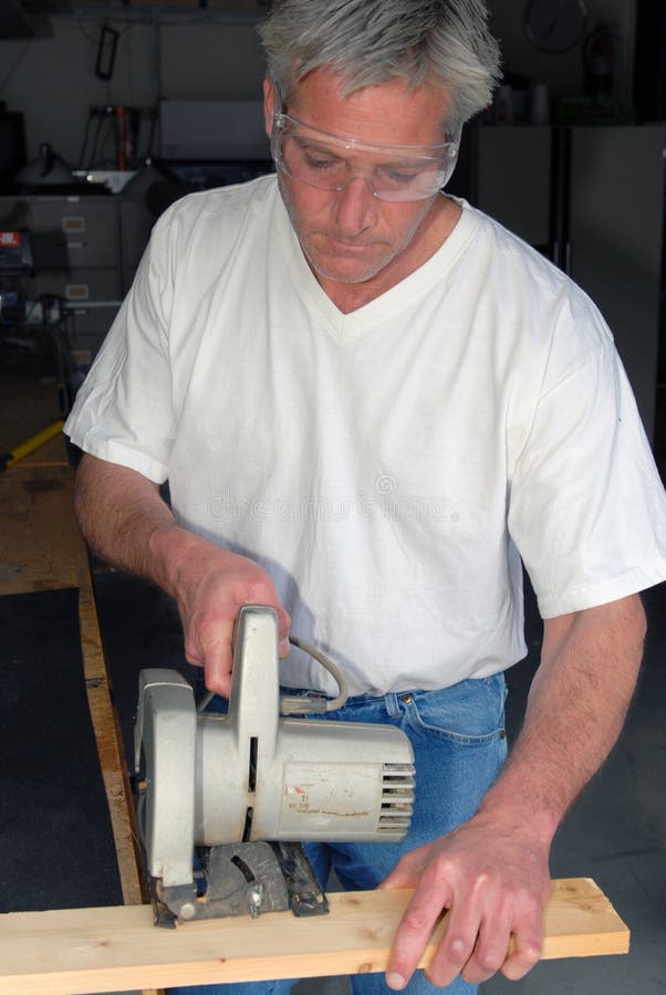 Man with skill saw stock image. Image of lumber, skill 13678435