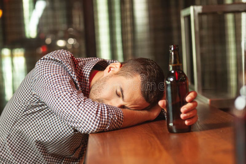 Man Sleeping on the Bar Counter Stock Photo - Image of sitting, person ...