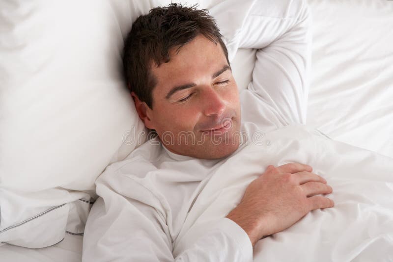 Man Sleeping Peacefully In Bed. Man Sleeping Peacefully In Bed