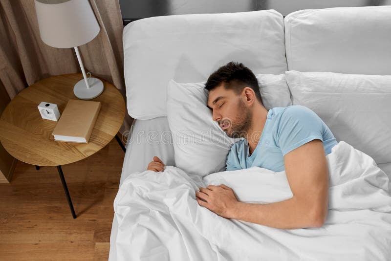 Man Sleeping in Bed at Home Stock Image Image of bedtime, bedding