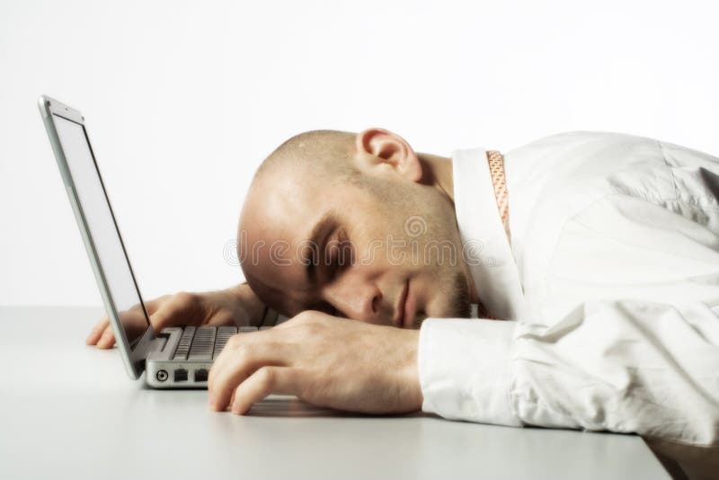 Man sleeping on laptop computer