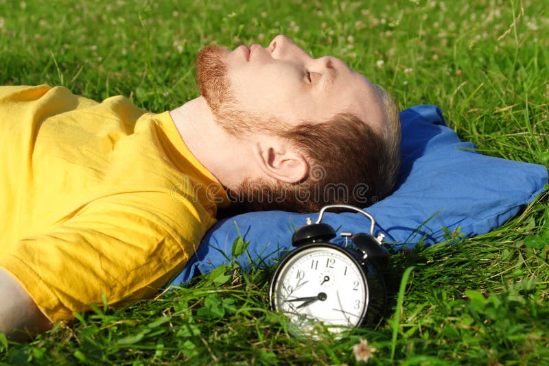 Man sleeping on summer meadow