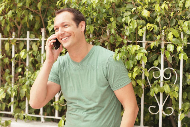 Man smiling on the phone stock image Man smiling on the phone stock image