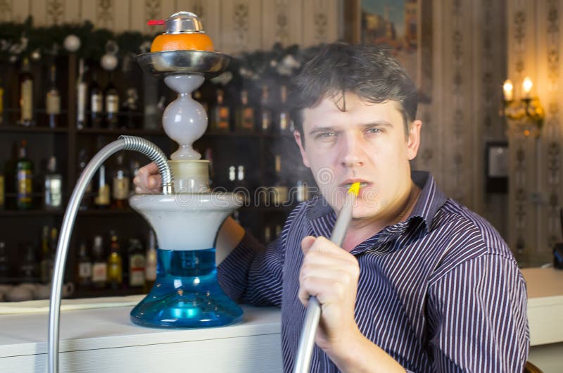 Man smokes a hookah stock image. Image of contemplation 36882247