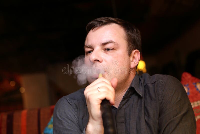 Man smoking water pipe stock image. Image of asian, male 64483227