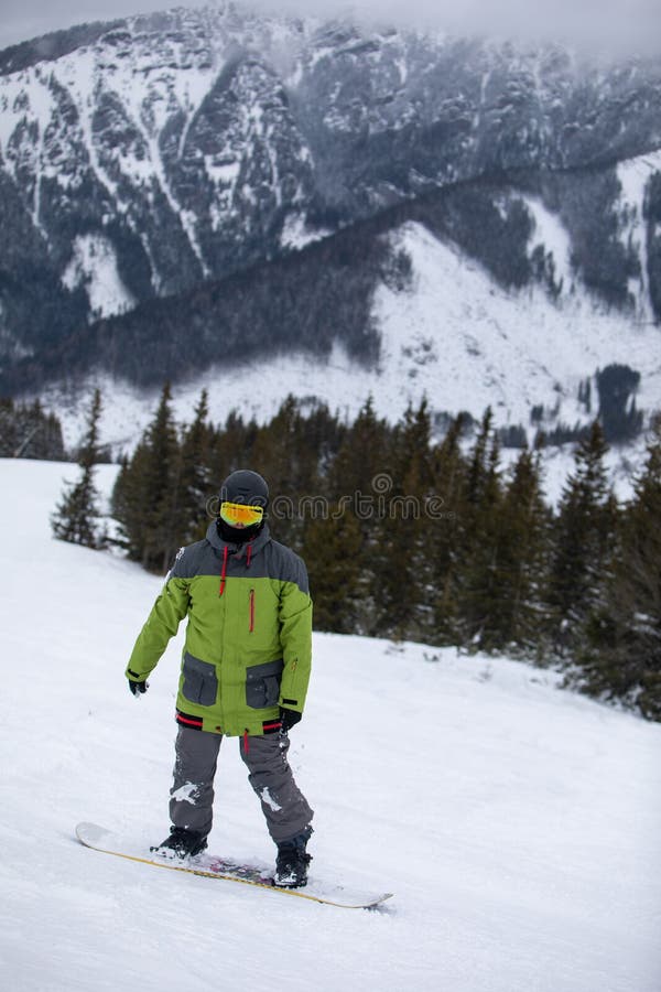 Man snowboarder portrait on ski slope