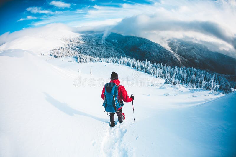 Download A Man In Snowshoes In The Mountains In The Winter. Stock Photo - Image of cold, adventure: 107689716