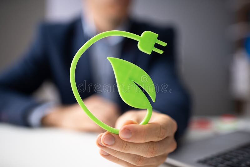 Man Holding Renewable Green Energy Concept In Hand. Man Holding Renewable Green Energy Concept In Hand