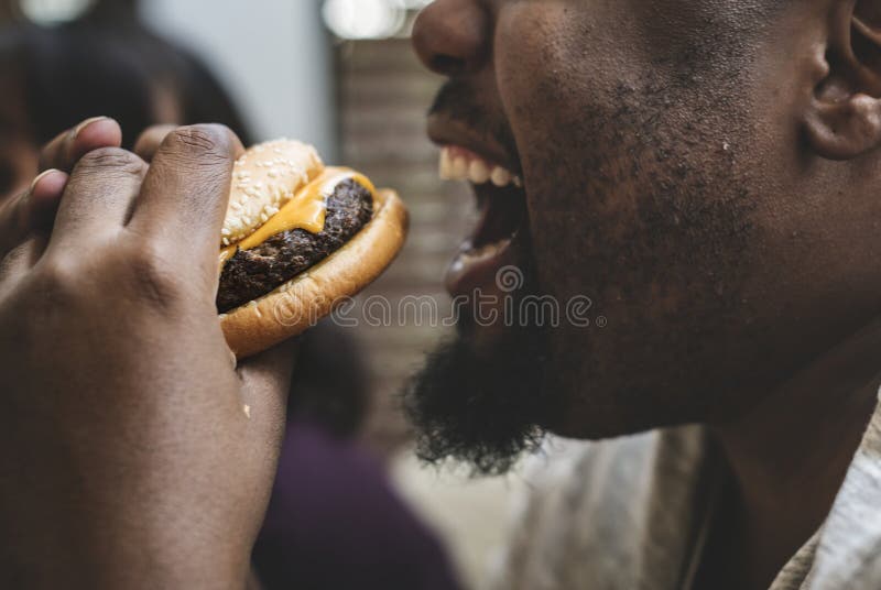 Man eating a big hamburger. Man eating a big hamburger