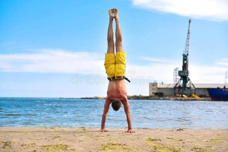 Man standing on hands stock photo. Image of adult, concentration 75407240