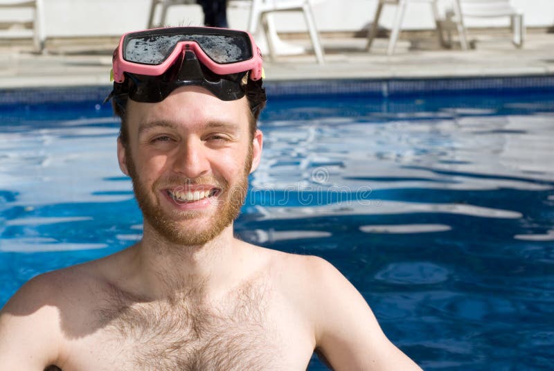 Man Standing in Pool Wearing Goggles - Horizontal