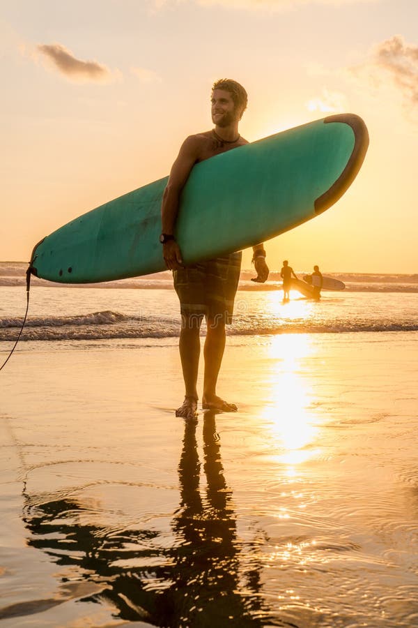 Surfer With Surfboard On The Beach Stock Image Image Of Horizontal