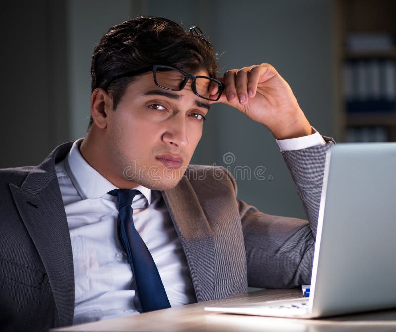 Man Staying in the Office for Long Hours Stock Photo Image of pile