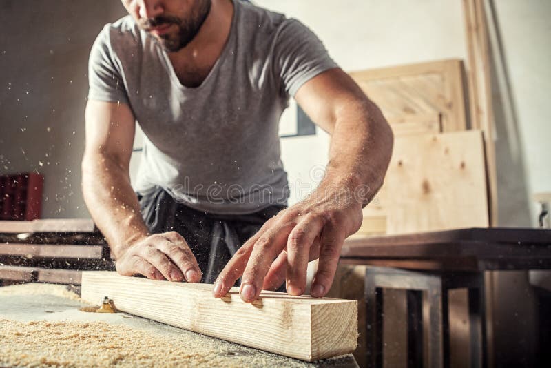 Man steals a wooden with a milling machine