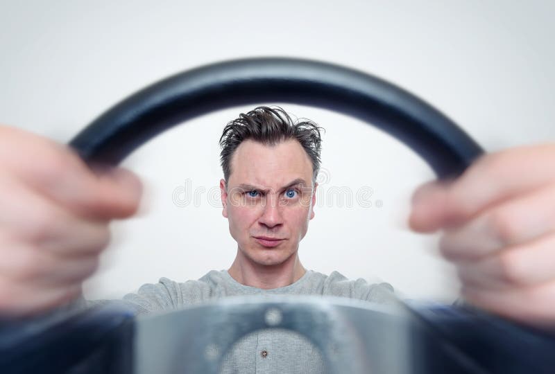 Man with a steering wheel, front view. Driver car concept stock image