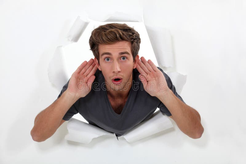 Man strenuously listening stock images