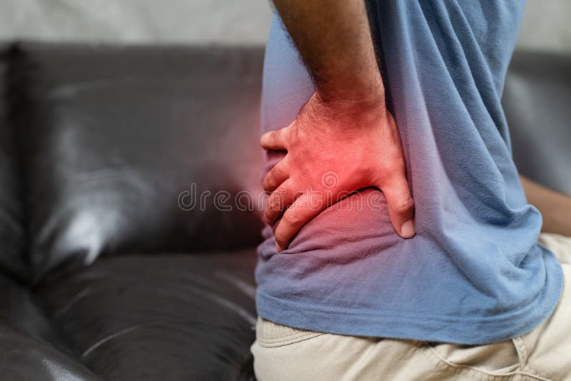 Man Suffering from Back Pain on the Sofa at Home Stock Photo Image of