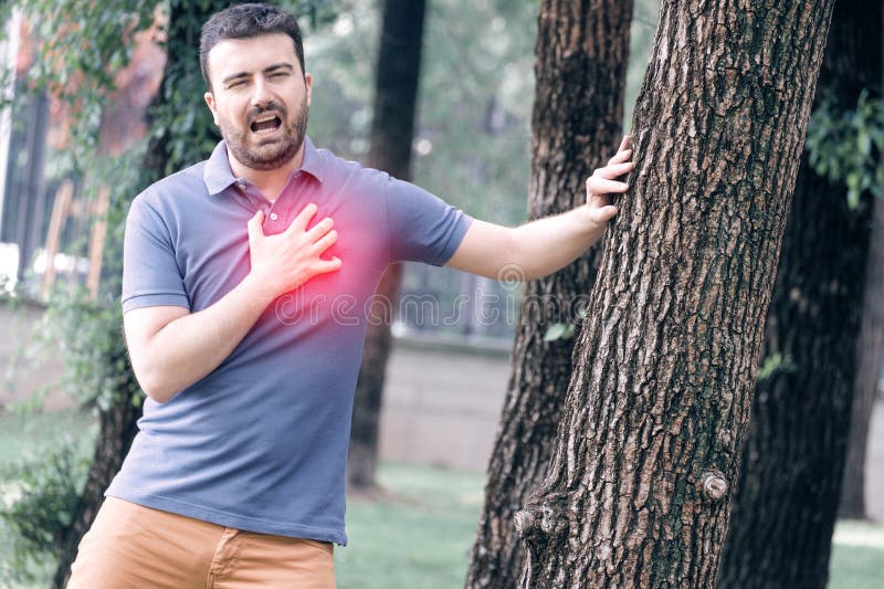 Man feels heartache suffering from cardio ailments and clutching