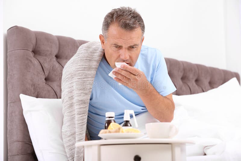 Man Suffering from Cough and Cold in Bed Stock Photo Image of disease