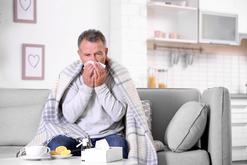 Man Suffering from Cough and Cold on Sofa Stock Photo Image of cough