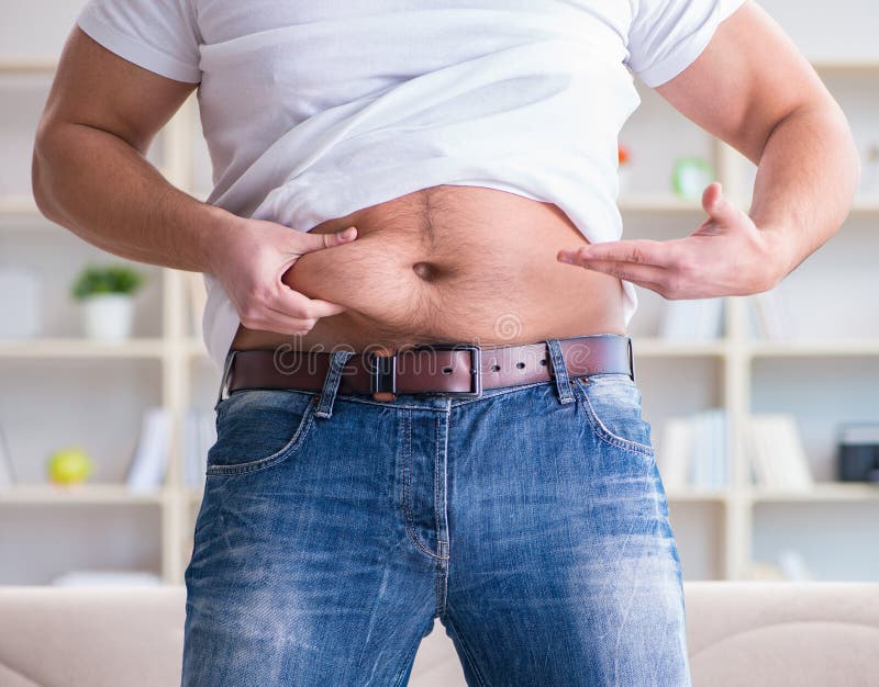 Man suffering from extra weight in diet concept royalty free stock image Man suffering from extra weight in diet concept royalty free stock image