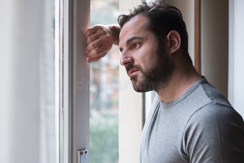 Man suffering and feeling alone at home royalty free stock photography Man suffering and feeling alone at home royalty free stock photography