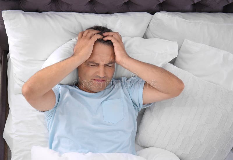 Man Suffering from Headache after Sleep in Bed Stock Photo Image of