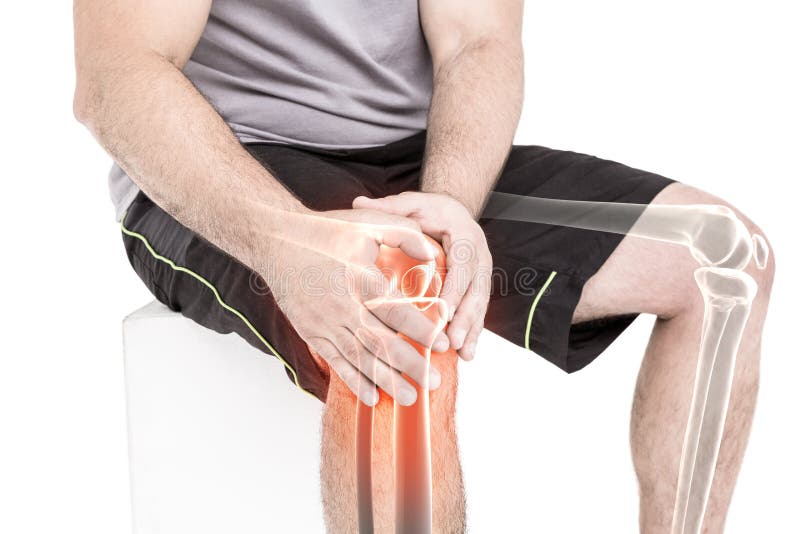 Man suffering with knee pain while sitting against white background