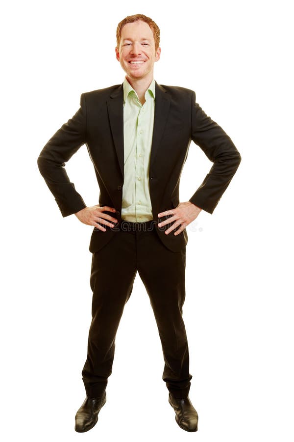 Man with a suit as a businessman with arms akimbo