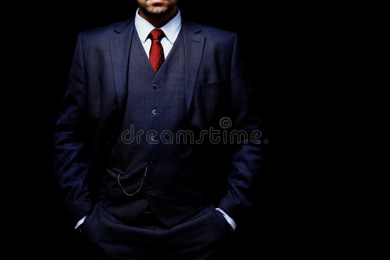 Man in suit on black background