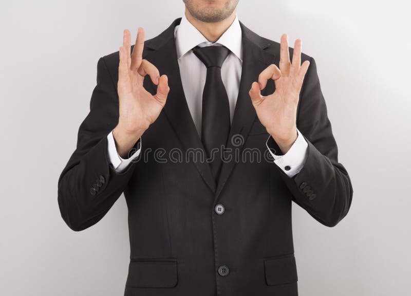 man in suit doing hand signs royalty free stock photography man in suit doing hand signs royalty free stock photography