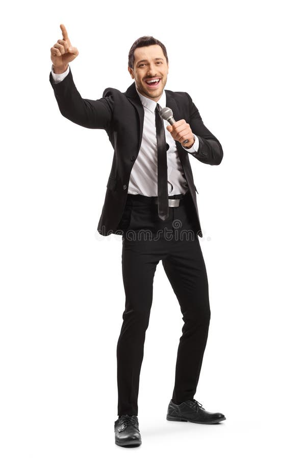 Man in a Suit Holding a Microphone and Gesturing with Finger Stock ...