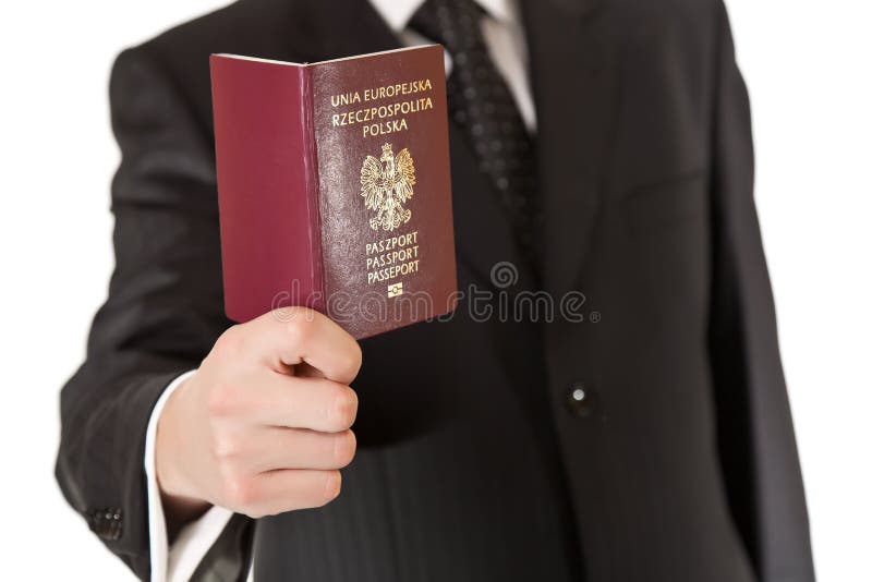 Man in suit holding passport