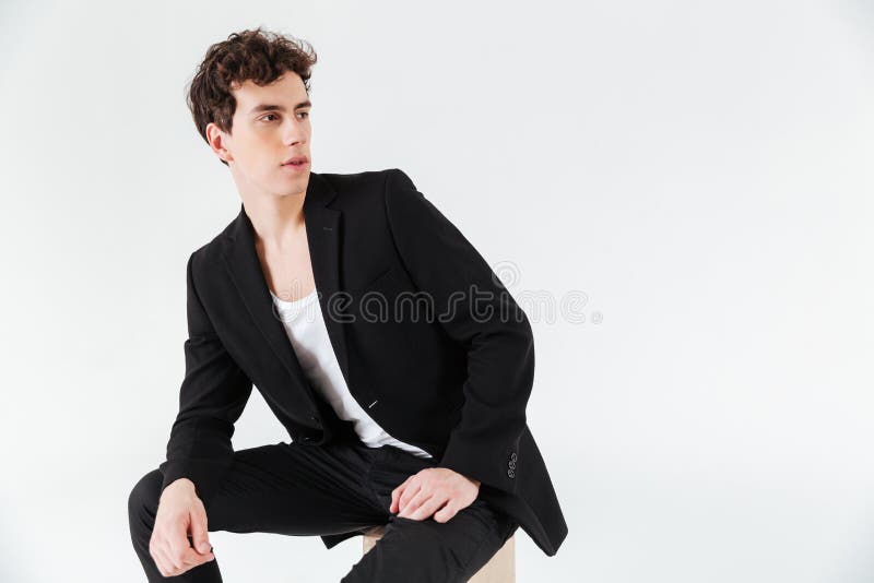Man in Suit Sitting on Box and Looking Away Stock Image - Image of head ...