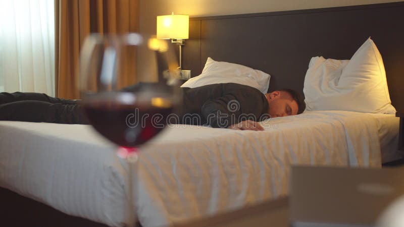 Man in Suit Sleep in Hotel Room on the Background of Glass of Wine Stock  Photo - Image of males, beauty: 167709596