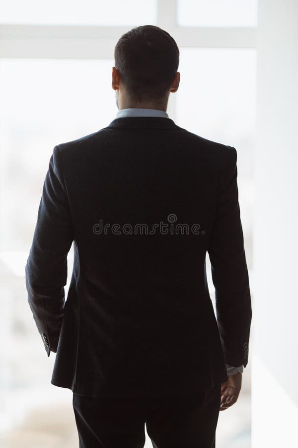 A Man in Suite at the Window Stock Image - Image of evening, clothing ...